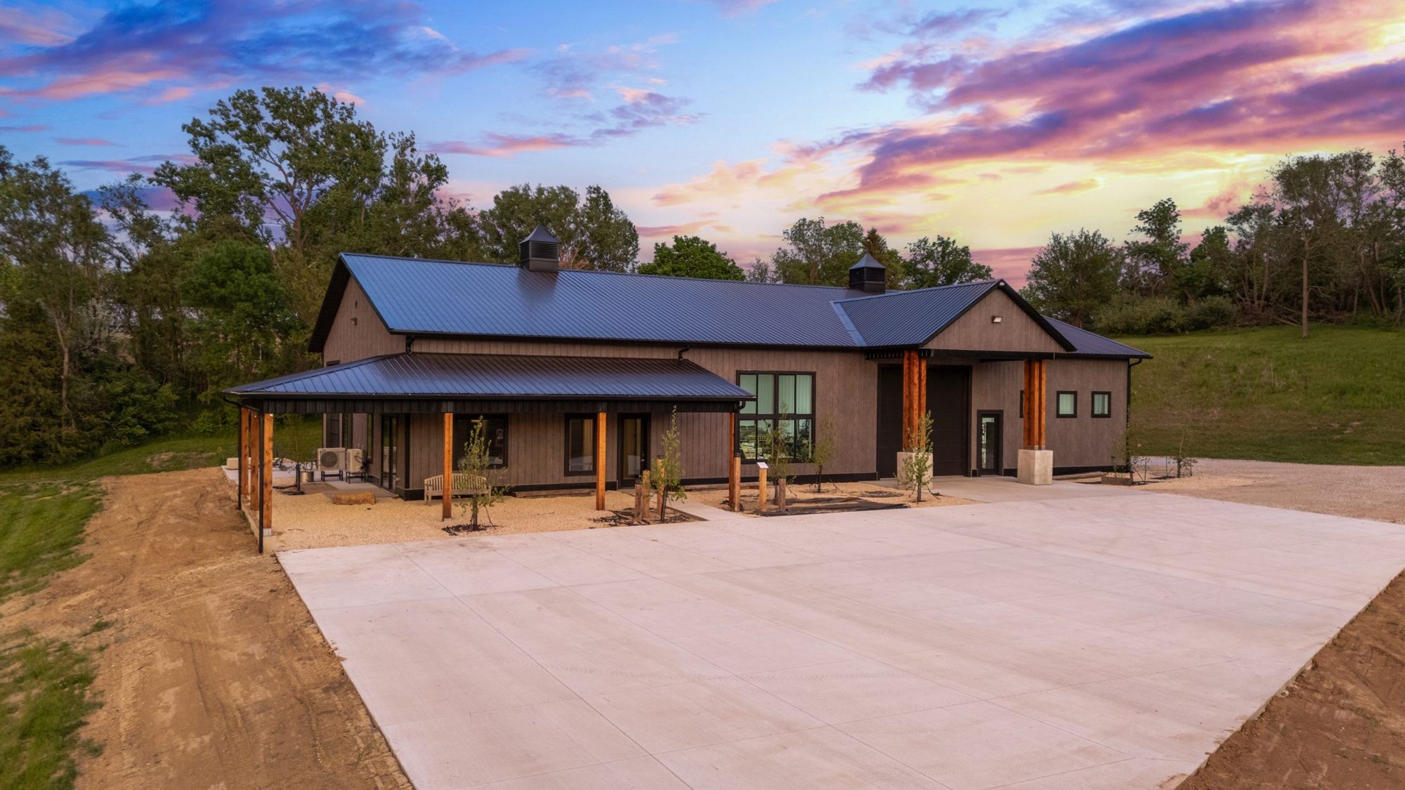 Barn and concrete court at sunset