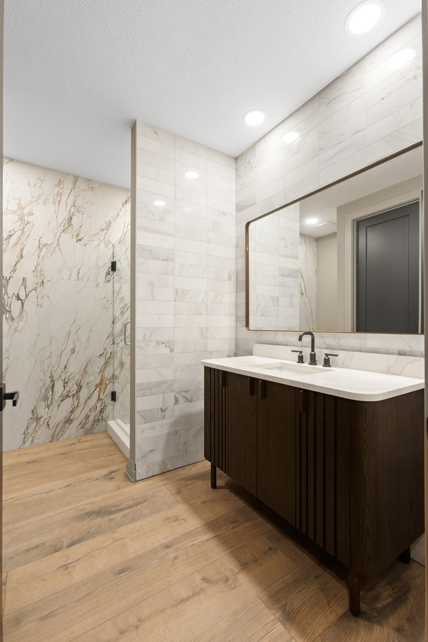 Bath with marble shower and walnut vanity