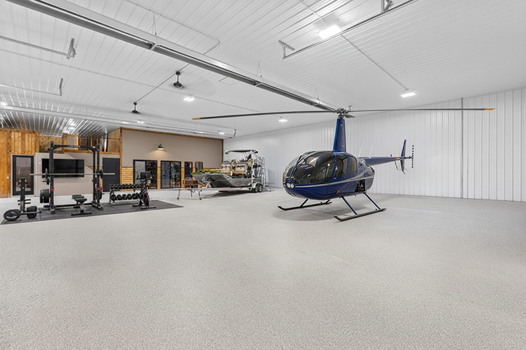 Barn interior with a home gym and a helicopter
